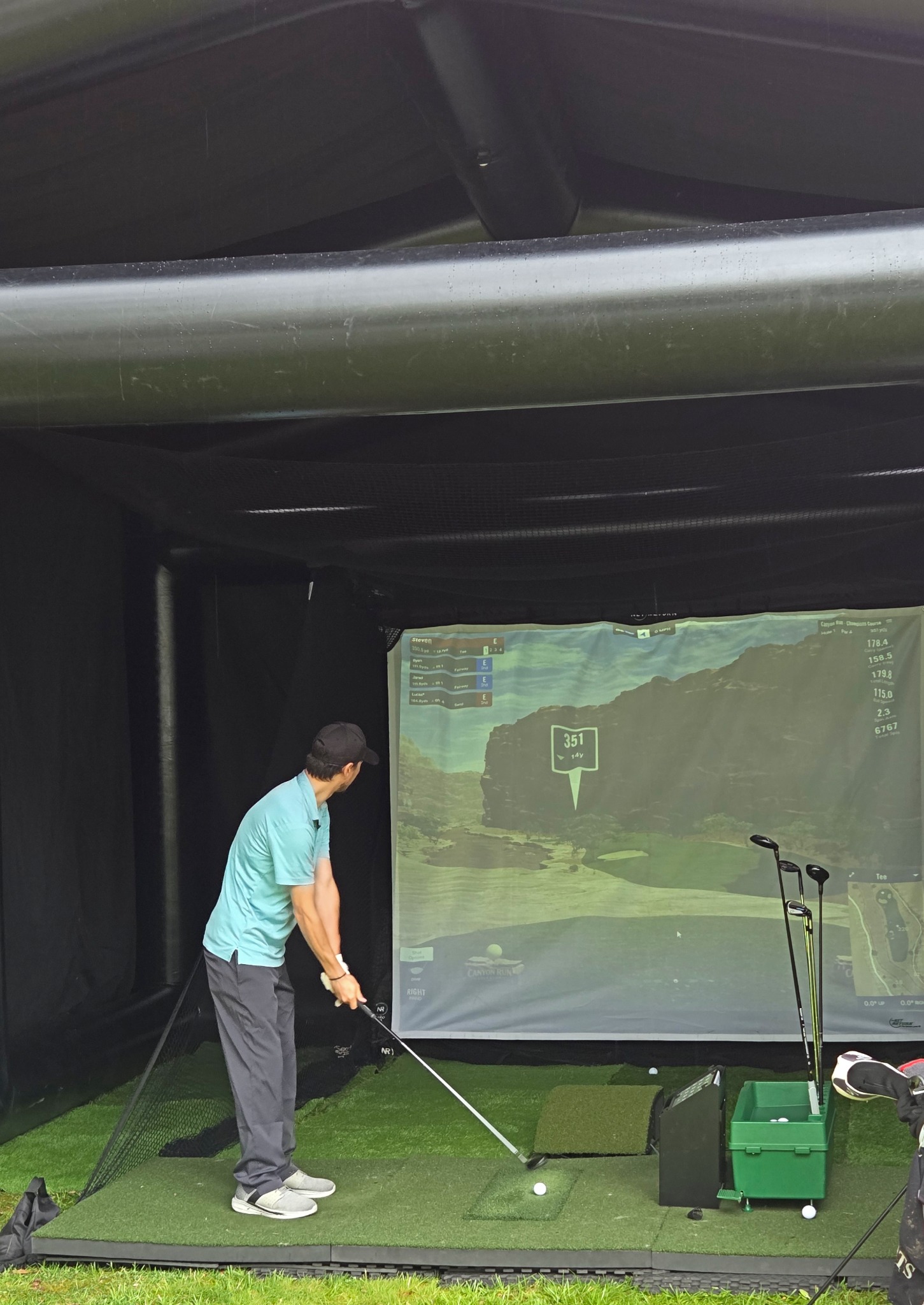 Golfer using simulator